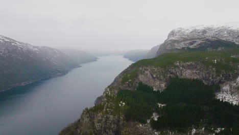 Incredible-view-of-a-mountain-range-covered-in-mist-and-fog-in-Scandinavia