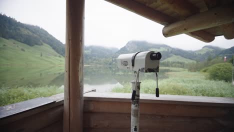 Smooth-dolly-traveling-front-sightseeing-monocular-overlooking-scenic-mountain-lake