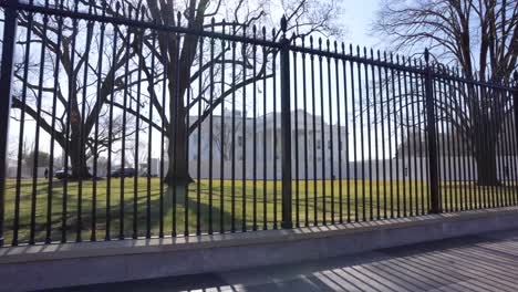 A-glide-shot-from-behind-the-gates-of-the-White-House-on-a-nice-sunny-day