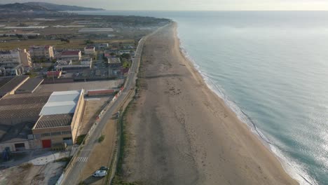 Aerial-view-of-small-town-Spain-in-the-Maresme-Malgrat-de-Mar-Santa-Susana-In-winter-beach-without-people