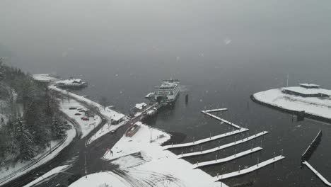 Cars-slowly-unload-from-a-Washington-State-ferry-at-Point-Defiance,-Tacoma,-aerial