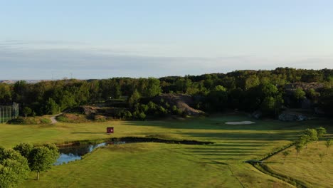 Aerial-rising-over-tree-of-golf-course,-Molndal-near-Gothenburg