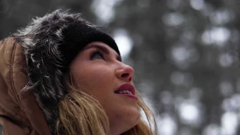 Tight-shot-of-a-beautiful-blonde-women-in-awe-looking-at-her-surroundings-in-a-pine-forest-in-Canada