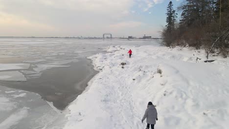 Establishing-shot-couple-walking-in-a-winter-landscape