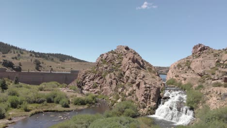 Rotating-aerial-at-Potato-Gulch-dam-for-Tarryall-Reservoir,-Colorado