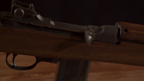Close-dolly-of-closed-receiver-of-the-classic-m1-carbine-rifle