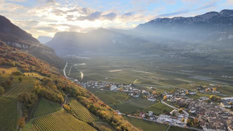 Aerial-Drone-Over-the-Vineyards-over-a-massive-valley-in-Autumn-in-South-Tyrol