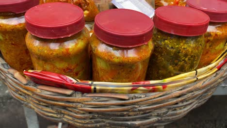 Close-up-shot-of-street-vendors-selling-wide-variety-of-pickles-or-Aachar-in-his-shop