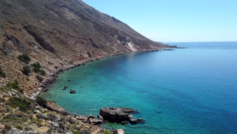 Panoramic-view-of-the-meeting-between-the-arid-Cretan-mountains-and-the-turquoise-waters-of-the-Libyan-Sea