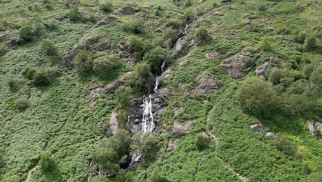 Drone-aerial-footage-of-the-Taylor-Gill-Force-Waterfall-situated-at-Borrowdale,-Seathwaite-and-is-one-of-the-highest-waterfalls,-in-the-Lake-District-National-Park