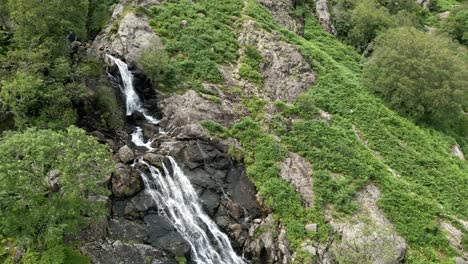 Drone-aerial-footage-of-the-Taylor-Gill-Force-Waterfall-at-Borrowdale,-Seathwaite-and-is-one-of-the-highest-waterfalls,-in-the-National-Park-Lake-District-England