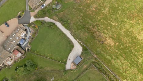 Aerial-footage-of-a-rural-Yorkshire-Village-with-a-mill-chimney