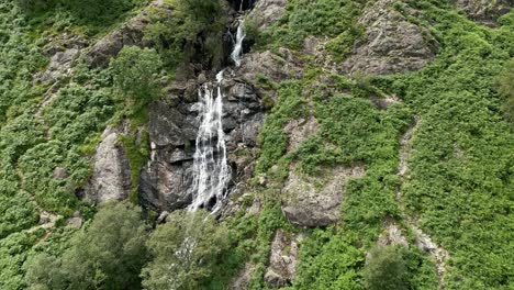 Drone-aerial-footage-of-the-100ft-Taylor-Gill-Force-Waterfall-at-Borrowdale,-Seathwaite-and-is-one-of-the-highest-waterfalls,-in-the-Lake-District-National-Park