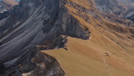 Italian-Dolomites-mountains-jagged-sharp-edge-at-fall-season,-establish-aerial-shot