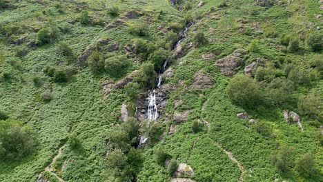 Drone-aerial-footage-of-the-steep-Taylor-Gill-Force-Waterfall-at-Borrowdale,-Seathwaite-and-is-one-of-the-highest-waterfalls,-in-the-Lake-District-National-Park