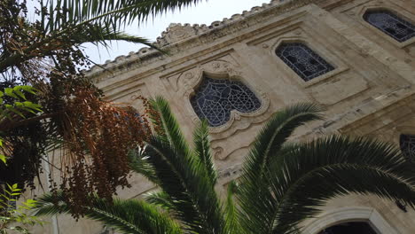 Artistic-framing-of-the-Byzantine-church-of-Agios-Titos-surrounded-by-palm-trees