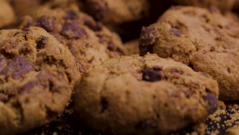 Extremely-close-up-shot-of-vegan-or-vegetarian-cookies-with-chocolate-on-black-background