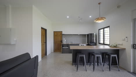 Contemporary-modern-open-plan-kitchen-in-house,-grey-cupboards