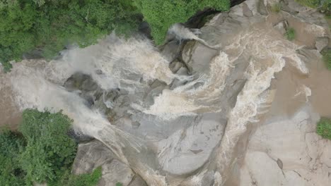 Aerial-view-of-Flowing-Stream-of-Water-in-a-Rocky-Terrain