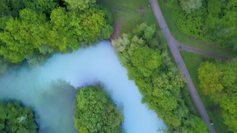 Top-down-aerial-view-of-road-by-the-river