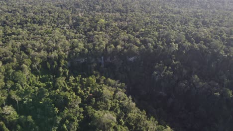 A-dynamic-aerial-footage-of-Salto-Arrechea-Falls-in-the-middle-of-Puerto-Iguazu-jungle-in-Sendero-Macuco,-Misiones,-Argentina