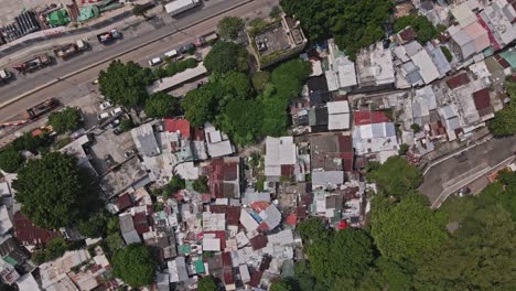Top-down-Aerial-drone-rotating-shot-over-Cha-Kwo-Ling-village,-Hong-Kong,-China
