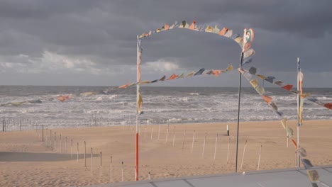 Flags-waving-at-the-beach-of-De-Haan