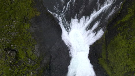 Aerial-zenith-shot-of-the-Haifoss-waterfall-in-the-mountain-gorge-of-Fossárdalur,-in-Iceland