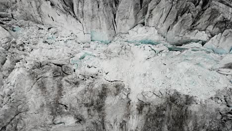 Aerial-view-over-the-Moiry-glacier-near-Grimentz-in-Valais,-Switzerland-with-a-top-down-view-of-the-icy-crevasses