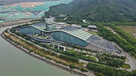 Rising-Drone-View-of-T-Park,-Sludge-Treatment-Facility-in-Nim-Wan-Road,-Tuen-Mun,-Hong-Kong