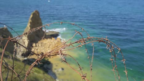 Cliffs-of-Point-Du-Hoc-in-Normandy-France-with-barbed-wire-from-D-Day-landings