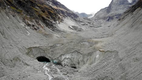 Aerial-flyover-over-crevasses-of-the-Zinal-glacier-in-Valais,-Switzerland