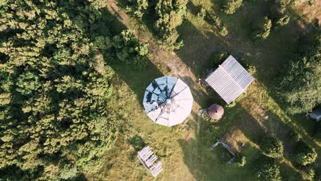 aerial-drone-flight-rotation-over-lost-place-lighthouse-roof---match-cut-round-circle---Estonia-in-Europe---nature-helicopter-flyover-establishing-shot-summer-2022---bird-view