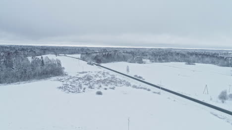 Snow-layered-Rovaniemi-Finland-outskirts-highway-aerial