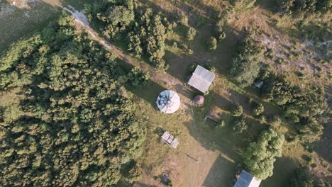 top-shot-down-aerial-drone-flight-over-lost-place-lighthouse-at-the-coast-of-baltic-sea---country-side-of-Estonia-in-Europe---nature-helicopter-flyover-establishing-shot-summer-2022---bird-view
