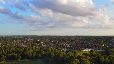 Drone-shot-of-residential-in-rural-area-in-the-morning-with-cloudy-blue-sky