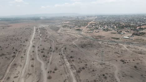 aerial-view-flying-from-the-city-to-the-desert-in-africa