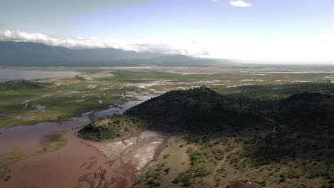 Beautiful-4k-drone-shot-of-the-mountains-and-Lake-Natron-in-Tanzania,-bordering-Kenya,-East-Africa