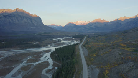 Aerial-View-Of-A-River-And-Road-With-Canadian-Rockies-Near-Nordegg-In-West-Central-Alberta,-Canada