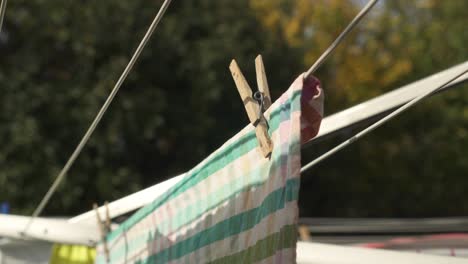 Colorful-Towel-With-Clothespin-Hang-To-Dry-Outdoor