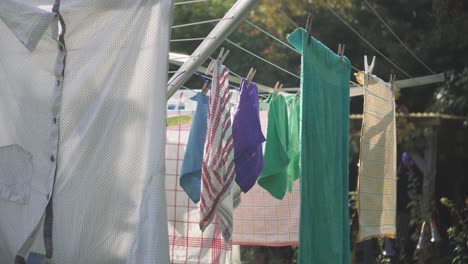 Clothes-Hanging-On-An-Outdoor-Drying-Rack-During-The-Daytime