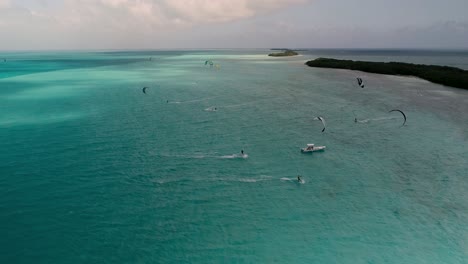 kitesurf-competition-sport-many-colourful-kites-on-caribbean-sea-water,-Los-Roques