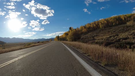 Driving-Plate---Highway-14-in-central-Colorado-during-the-fall-in-foothills-of-Rocky-Mountains