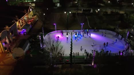 Christmas-Ice-Rink-outdoor-at-night-drone-shot