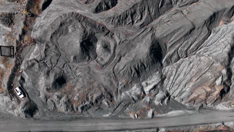 Top-down-aerial-of-piles-of-coal-at-strip-mine