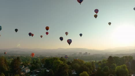 Drone-shot-of-hot-air-balloons-all-taking-part-in-a-festival