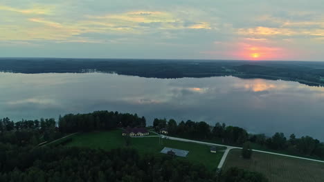 Calm-Reflective-Sunset-Lake-With-Cinematic-Aerial-Dolly-Left