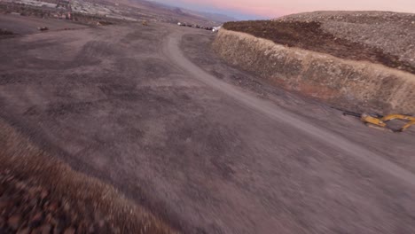 Fpv-drone-speed-flight-over-road-with-desert-dry-texture-sand,-Mojave-Desert,-Vegas