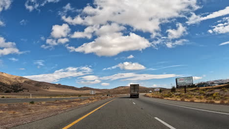 Driving-along-a-highway-through-the-Mojave-Desert-towards-the-Tehachapi-mountains