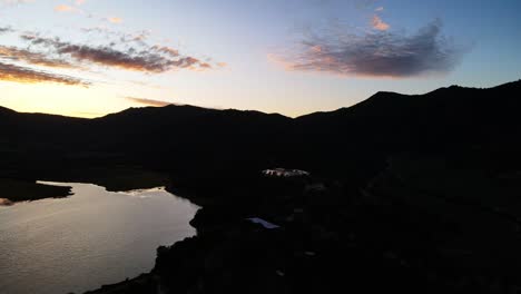 Aerial-shot-of-a-sunset-on-a-lake-in-Chile
